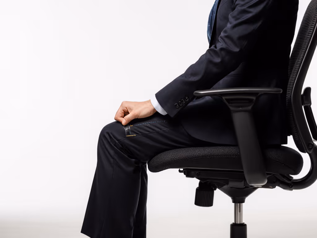 seat_depth_adjustment_showing_hand_measurement_against_knee_gap